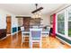 Bright dining room with hardwood floors and a farmhouse style table at 1530 Deer Park Ln., Surfside Beach, SC 29575