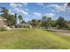 Spacious front yard with lush green grass and mature trees at 1530 Deer Park Ln., Surfside Beach, SC 29575