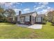 Brick house with deck and backyard at 1530 Deer Park Ln., Surfside Beach, SC 29575