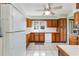 Galley kitchen with wood cabinets and a view of the backyard at 1530 Deer Park Ln., Surfside Beach, SC 29575