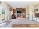 Living room with brick fireplace, built-in shelves, and hardwood floors at 1530 Deer Park Ln., Surfside Beach, SC 29575