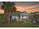 Outdoor patio area with seating and a built-in grill at 1810 N Cove Ct., North Myrtle Beach, SC 29582