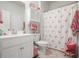 Bathroom with flamingo shower curtain and decor at 1810 N Cove Ct., North Myrtle Beach, SC 29582