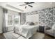 Spacious bedroom with floral wallpaper and a white shiplap headboard at 1810 N Cove Ct., North Myrtle Beach, SC 29582