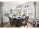 Charming breakfast nook with wicker chairs and a glass-top table at 1810 N Cove Ct., North Myrtle Beach, SC 29582