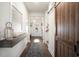 Bright and spacious entryway with a wooden sliding door and decorative accents at 1810 N Cove Ct., North Myrtle Beach, SC 29582