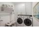 Laundry room with washer, dryer, and ample cabinet storage at 1810 N Cove Ct., North Myrtle Beach, SC 29582