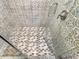 Walk-in shower with diamond patterned tile floor at 1819 North Ocean Blvd. # 8015, North Myrtle Beach, SC 29582