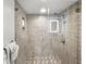 Walk-in shower with patterned tile and glass enclosure at 1819 North Ocean Blvd. # 8015, North Myrtle Beach, SC 29582