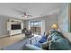 Living room with comfy teal couch, sliding doors to balcony at 1890 Colony Dr. # 17N, Myrtle Beach, SC 29575