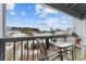 Small patio with table and chairs overlooking a community pool at 1890 Colony Dr. # 17N, Myrtle Beach, SC 29575