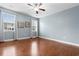 Bright bedroom featuring hardwood floors and two windows at 1901-B High St., Myrtle Beach, SC 29577