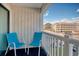 Private balcony with two chairs and partial ocean view at 191 Maison Dr. # B206, Myrtle Beach, SC 29572