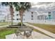 Community patio with table and chairs near pool at 191 Maison Dr. # B206, Myrtle Beach, SC 29572