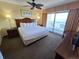 King-size bed, ocean view, and balcony access at 2007 S Ocean Blvd. # 1607, Myrtle Beach, SC 29577