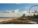 Beachfront view with Ferris wheel and pier at 201 Black Pearl Way, Myrtle Beach, SC 29588