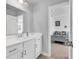 Simple bathroom with single sink vanity and view of bedroom at 206 Calhoun Falls Dr., Myrtle Beach, SC 29579