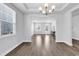 Bright dining room with hardwood floors and access to the living room at 206 Calhoun Falls Dr., Myrtle Beach, SC 29579