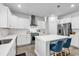 Modern kitchen with white cabinets, center island, and stainless steel appliances at 206 Calhoun Falls Dr., Myrtle Beach, SC 29579