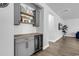 Modern wet bar with gray cabinets, wine cooler, and wood countertop at 206 Calhoun Falls Dr., Myrtle Beach, SC 29579