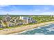 Enjoy this aerial view of these beachfront high-rise condos with views of the sandy beach and turquoise ocean at 210 75Th Ave N # 4010, Myrtle Beach, SC 29572