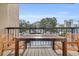 Outdoor balcony with wooden table and chairs, perfect for enjoying the view at 210 75Th Ave N # 4010, Myrtle Beach, SC 29572