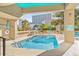 Inviting outdoor pool area with lounge chairs, lush landscaping, and city backdrop at 210 75Th Ave N # 4010, Myrtle Beach, SC 29572