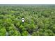 Overhead aerial view showing the property nestled among lush, dense trees providing privacy at 2102 Calabash Circle, Little River, SC 29566