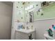 Simple bathroom with white vanity and light green walls at 2102 Calabash Circle, Little River, SC 29566