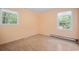 Inviting bedroom showcasing neutral walls, a window view, and hardwood floors at 2102 Calabash Circle, Little River, SC 29566