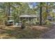 House exterior with golf cart and trees at 2102 Calabash Circle, Little River, SC 29566