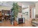 Living room with electric fireplace and view of kitchen at 2102 Calabash Circle, Little River, SC 29566