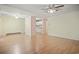 Spacious living room featuring hardwood floors and a peek into the bright kitchen at 2102 Calabash Circle, Little River, SC 29566