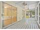 Rear screened porch featuring sliding doors and views of the lush, green backyard at 2102 Calabash Circle, Little River, SC 29566