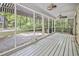 Enclosed back porch, complete with striped awnings and inviting outdoor charm at 2102 Calabash Circle, Little River, SC 29566