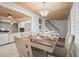 Bright dining room with wood table and seating for six at 2102 S Ocean Blvd. # D, North Myrtle Beach, SC 29582