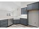 Corner kitchen with farmhouse sink, stainless steel appliances, and dark cabinets at 245 Six Mile Creek Dr., Georgetown, SC 29440