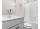 Simple bathroom with white vanity, tub shower combo, and linen storage at 3009 South Bay St., Georgetown, SC 29440