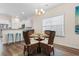 Bright dining room adjacent to kitchen, featuring a round table and chairs at 3009 South Bay St., Georgetown, SC 29440