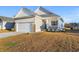 One-story house with a large front yard, attached garage, and front porch at 3009 South Bay St., Georgetown, SC 29440