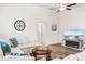 Living area with sectional sofa, TV, fireplace, and hardwood floors at 3009 South Bay St., Georgetown, SC 29440