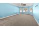 Spacious bedroom with neutral carpeting and light blue walls at 3047 Honey Clover Ct., Longs, SC 29568