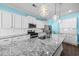 Modern kitchen with granite countertops and white cabinets at 3047 Honey Clover Ct., Longs, SC 29568