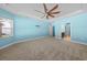 Main bedroom with ceiling fan and neutral carpeting at 3047 Honey Clover Ct., Longs, SC 29568