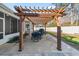 Relaxing patio with pergola, table, chairs, and grill at 3047 Honey Clover Ct., Longs, SC 29568