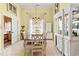 Bright dining room features a formal table, chandelier, and built-in hutch at 311 Highfield Loop, Myrtle Beach, SC 29579