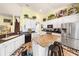 Modern kitchen featuring white cabinets, granite countertops and stainless steel appliances at 311 Highfield Loop, Myrtle Beach, SC 29579