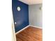 Small bedroom with blue and gray painted walls and wood flooring at 3586 Cluster Ln., Myrtle Beach, SC 29579