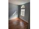 Image shows a bedroom with light grey walls and wood flooring at 3586 Cluster Ln., Myrtle Beach, SC 29579