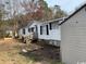 White single-wide mobile home with storage shed and unkempt yard at 3586 Cluster Ln., Myrtle Beach, SC 29579